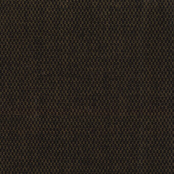 Woven fabric sample, muted brown and golden-yellow, geometric interlocking pattern with raised texture and “turri” brand tag visible.